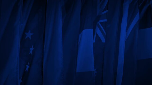 International Flags Hanging In Dark Room Before Event