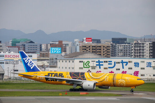 Fukuoka, Japan - July 10, 2019: An ANA All Nippon Airways Boeing 777-200ER (Registration JA743A) in special "C-3PO STAR WARS" livery taxiing at Fukuoka Airport.