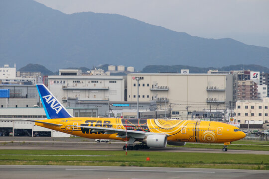 Fukuoka, Japan - July 10, 2019: An ANA All Nippon Airways Boeing 777-200ER (Registration JA743A) in special "C-3PO STAR WARS" livery taxiing at Fukuoka Airport.