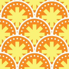 Seamless geometric pattern with orange and yellow scalloped circles © BERLANS