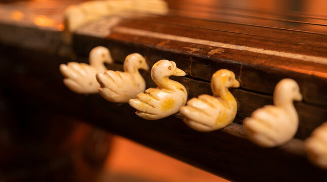 Vintage guqin with ivory duck-shaped tuning pegs