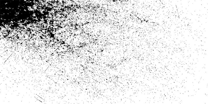 Abstract black and white grunge background with a rough, dirty concrete wall texture and vintage paint pattern