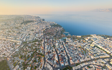 Obraz premium Antalya, Turkey. Aerial view of the historic Kaleici district nestled between the sea and modern city, highlighting its unique position as an ancient island in a contemporary setting. Aerial view.