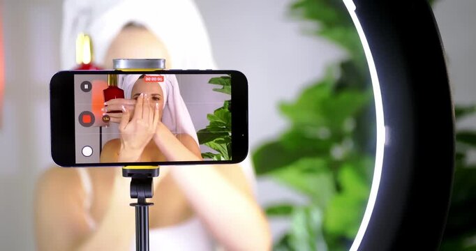 Influencer Filming Makeup Tutorial at Home