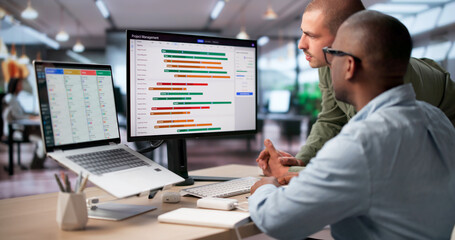 Project Manager And Team Review Digital Gantt Chart Tracking Project © Andrey Popov