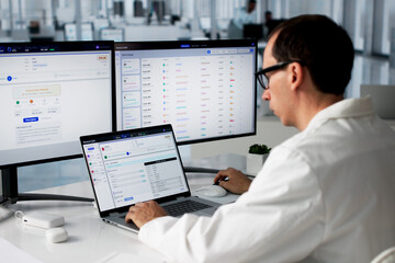 Healthcare Billing Manager Uses Laptop