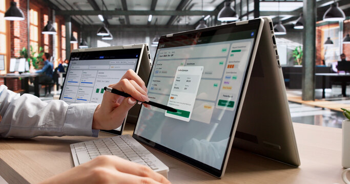 Young Woman Uses Laptop And Tablet