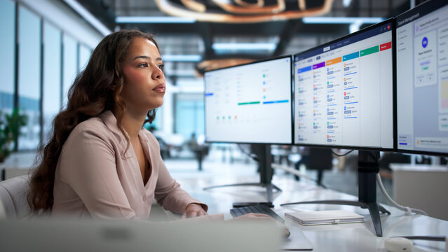 Young HR Manager Using Computer To Track Employee Data