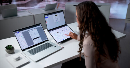 Woman Reviews Financial Expense Reports On Laptop