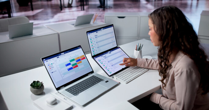 Young Hispanic Woman Reviews Talent Acquisition Data