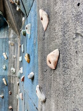 outdoor wall climbing arena, with randomly installed rock textures, adrenaline sports and high risk