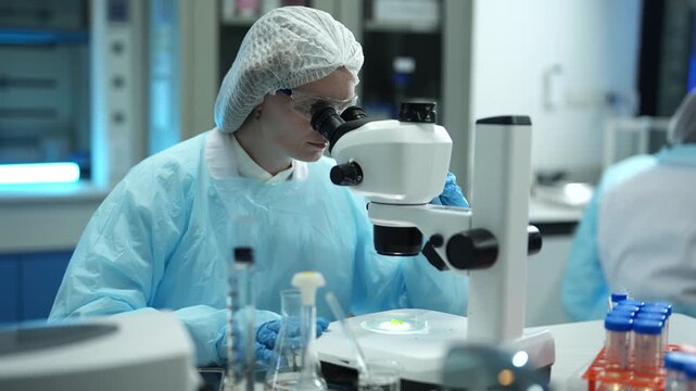 Lab work, scientists holds a test tube takes the test from a test tube in analysis for vaccine development.