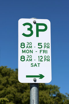 Australian green and white 3P parking sign indicating a three-hour parking limit during designated daytime hours on weekdays and Saturdays against a clear blue sky