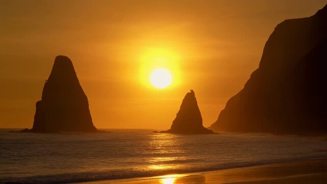 A stunning golden sunset over the ocean, featuring majestic rocky sea stacks and cliffs in silhouette with the bright sun reflecting on the waves.