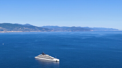Aerial View of a Large White Superyacht Off the Italian Riviera Coastline © blueringmedia