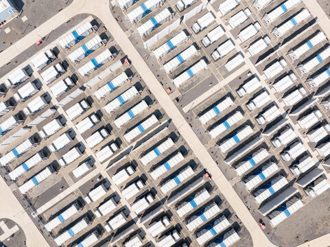 Aerial view of temporary modular housing isolation camp arranged in neat rows for emergency medical use