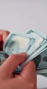 Hands, fraud and person counting cash for bribery payout, money laundering or corruption income. Cashback, illegal lender and dollar bills on closeup for interest rate, financial crime and extortion