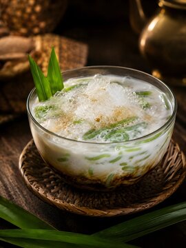 Traditional southeast asian cendol dessert with shaved ice and coconut milk