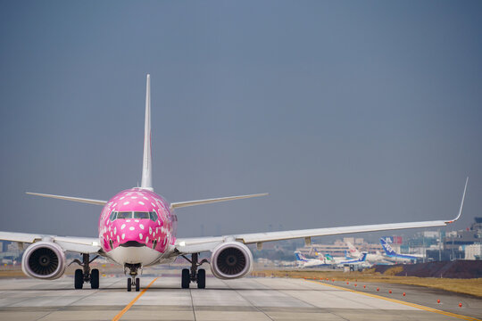 Fukuoka, Japan - February 16, 2019: A Japan Transocean Air (JTA) Boeing 737-800 (Registration JA06RK) in special "Sakura Jinbei Jet" livery taxiing at Fukuoka Airport.