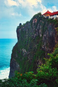 




Bali, Indonesia - June 7, 2022: The Uluwatu Temple on a Cliff. Perched dramatically on a steep cliff, Uluwatu Temple stands at an elevation of 97 meters above sea level, offering breathtaking oce
