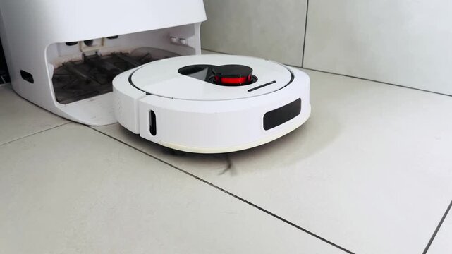 Robot vacuum cleaner charging on tile floor with detailed textures and minimalistic design