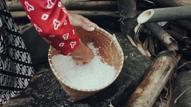 Hands washing the rice grains