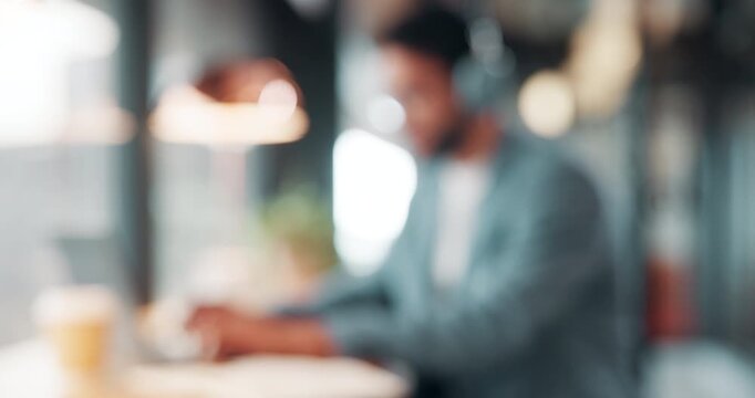 Blurred, business person and typing in cafe with remote worker, headphones and laptop with workflow. Man, bokeh space or writing report with tech, out of office or hybrid work with audio in bistro