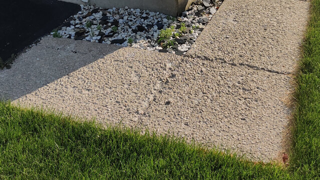 Exposed Aggregate Concrete Sidewalk Along Residential Home