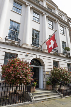 Swiss Embassy building with flag. London, UK, 14 April 2023