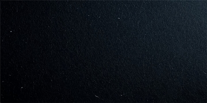 A dark macro closeup of a rough black leather and fabric material surface reveals a textured grunge pattern, creating an old textile wallpaper backdrop with a grey cloth canvas design