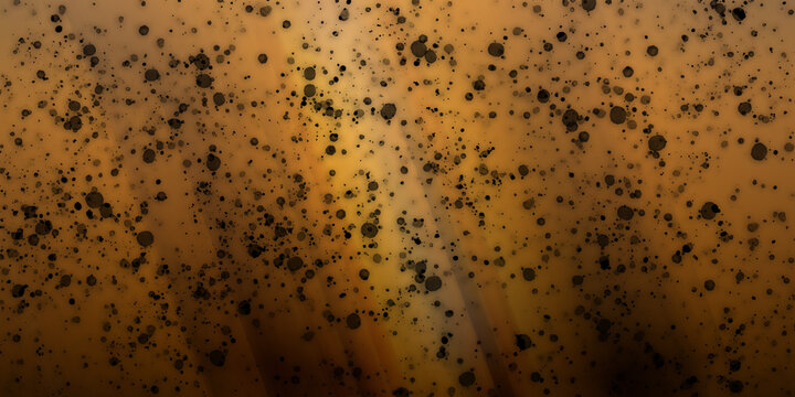 Abstract background with black ink splatters on an amber gradient