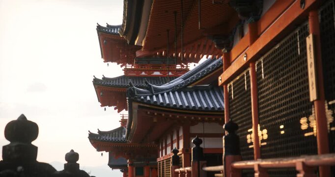 Rain dripping off beautiful, ancient Japanese structures - steady cam tracking shot