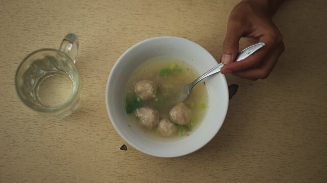 Top Down Shot of Meatball Soup Served in a Bowl
