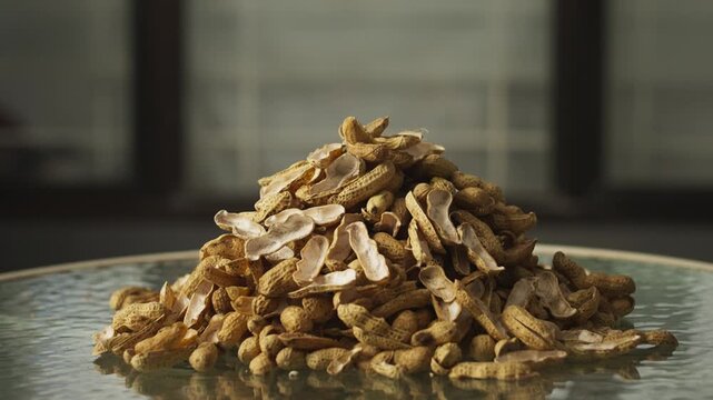 Close Up of Discarded Peanut Shells on Table Surface