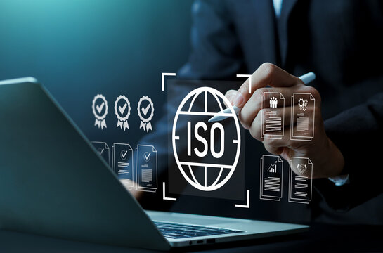 Business professional reviewing ISO certification and compliance standards on digital interface, quality management system, international accreditation, risk assessment and audit documentation concept