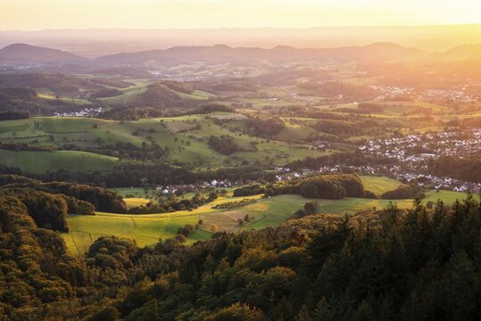 View of the Odenwald from the drum tower in Rimbach. The villages of Zotzenbach and M&ouml;rlenbach. Forest, meadows, fields. Sunset. Rimbach, Bergstrasse district, Odenwald, Hesse, Germany
