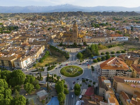 Aerial view of a city with historical centre, roundabout and surrounding landscape, mountains in the background, aerial view, cathedral, Catedral de la Encarnaci&oacute;n de Guadix, Guadix, Sierra Nevada, Granada, Andalusia, Spain