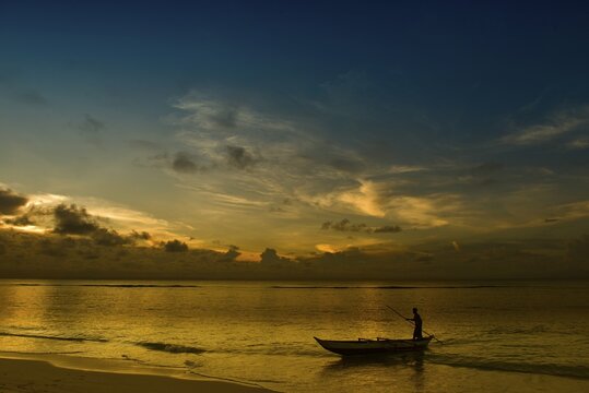 Pirogue on beach, sunset, East Coast, Madagascar