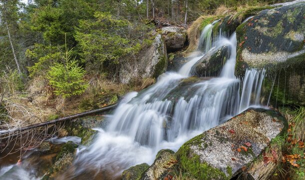 Small waterfall at Kreuzbach, small mountain stream flows over stones covered with moss, Bavarian Forest, Lower Bavaria, Bavaria, Germany