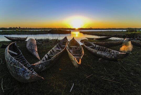 Fisherman repairs his net at sunset, Canal des Pangalanes, Mankara, Madagascar