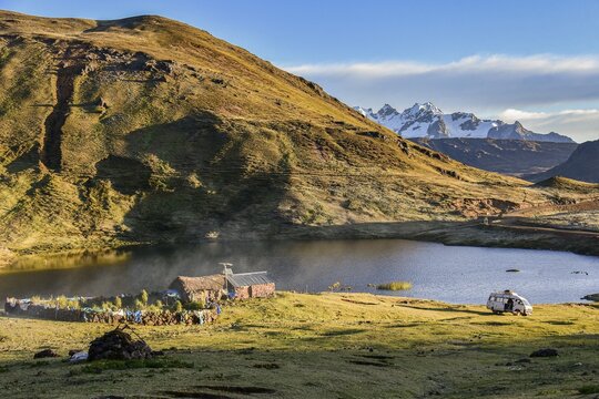 Houses on a lagoon in the Peruvian highlands, Andes, near Cusco, Peru, South America