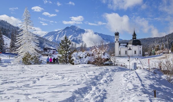 Seekirchl with artificial winter fir tree and Hocheder 2797m in winter, Seefeld, Seefeld Plateau, Tyrol, Austria