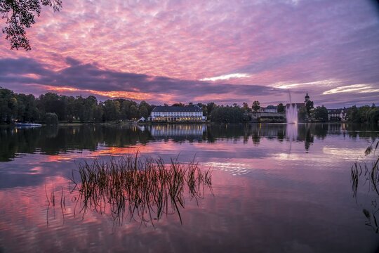 Lake Burgsee, Burgseeklinik hospital and the Old Town at dusk, Bad Salzungen, Thuringia, Germany