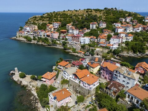 Aerial view of a coastal community with densely built red roofs and hills in the background, aerial view, island, Amasra, Sesamos, Bartin province, Bartın, Black Sea, Turkey