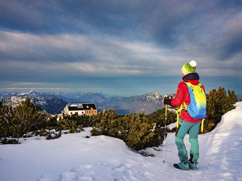 Mountaineer on a snowy path near the St&ouml;hrhaus, in the background the Chiemgau Alps, Untersberg, Berchtesgaden, Berchtesgadener Land, Upper Bavaria, Bavaria, Germany