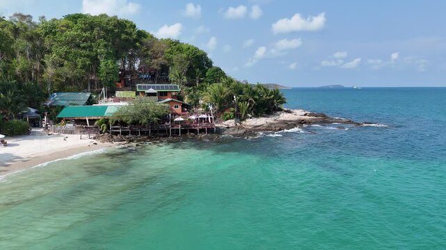 Aerial Orbit Around Rocky Shoreline of Ko Samet Pull Back Revealing Entire Beach Thailand