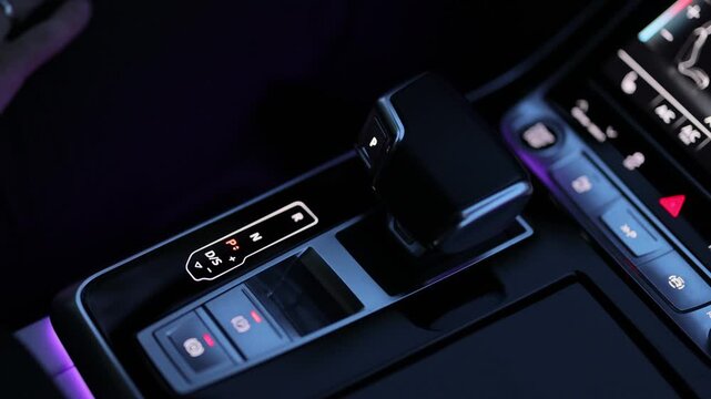 Automatic transmission, automatic gear shift, is moved to P Park. Male hand shifts gears. Man finger moves the gear lever in the car, P Parking position. Travel and vacation concept.