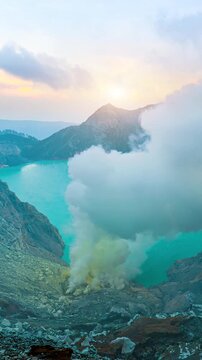 Sulfur fumes from the crater of Kawah Ijen Volcano in Indonesia. Vertical.