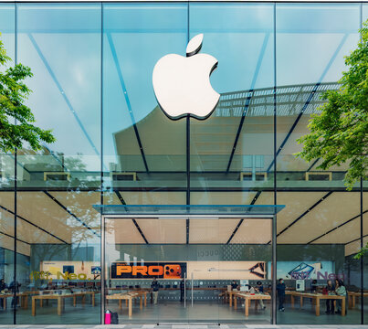 Hangzhou, China - April 17, 2026: Contemporary Apple Store facade with a large white logo on a clear glass building in daylight