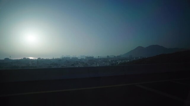Wide Shot of Khor Fakkan Civty and Port from Car &ndash; Morning View in 4K